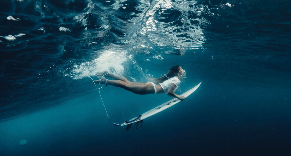 Female surfer underwater